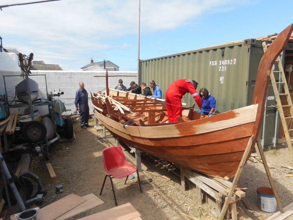 Image of Banff Academy pupils boat building at Cullen Sea School