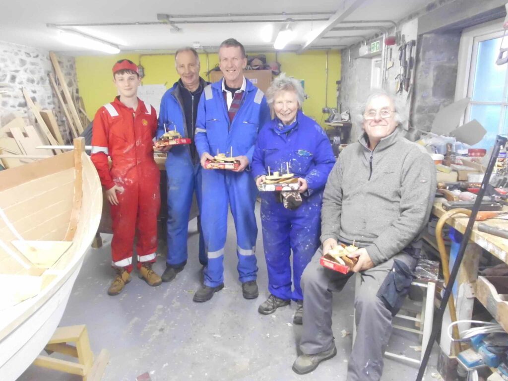 Image of Banff Academy pupils in the boat building workshop at Cullen Sea School