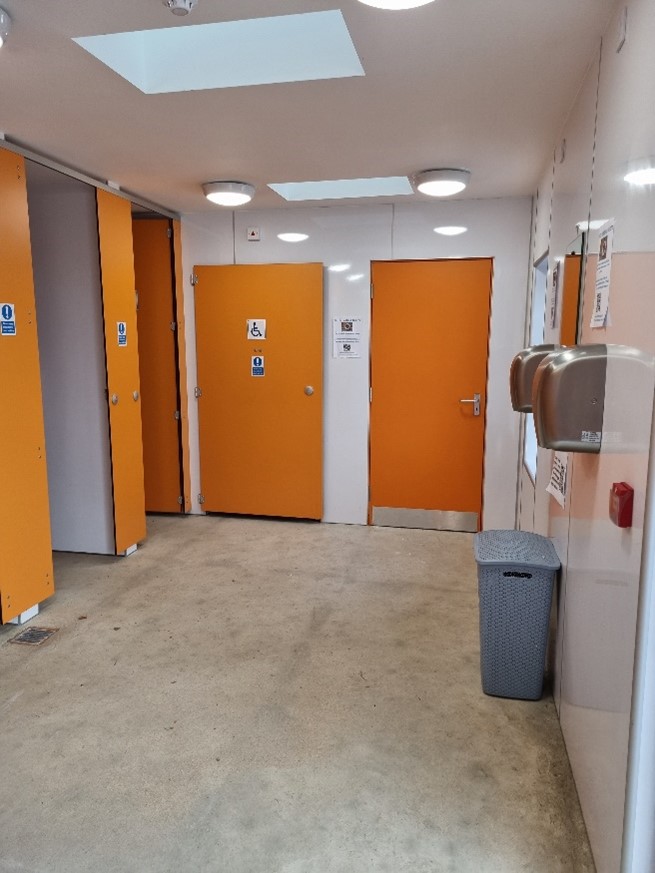 Image showing inside of Cullen Harbour Toilets with Accessible Toilet at back left.