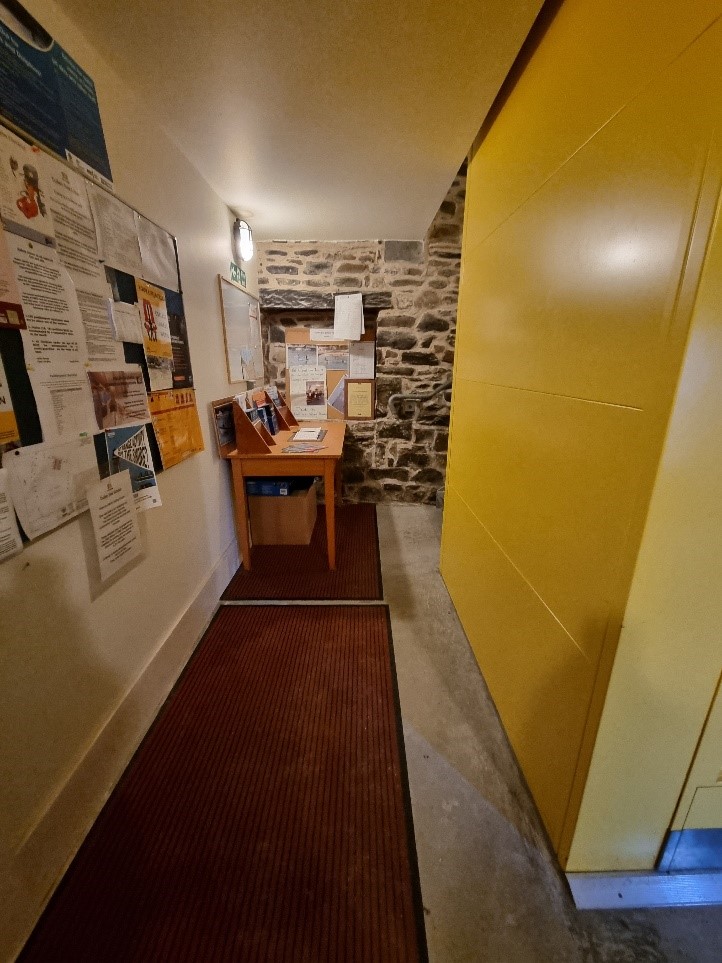 Image showing walkway from front door to bottom of stairs.