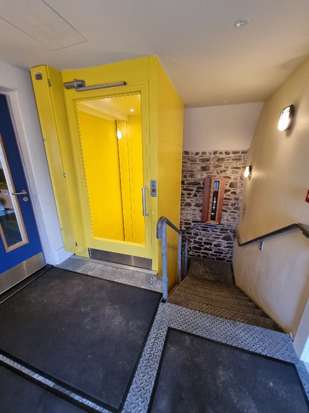 Image showing landing at top of stairs and lift