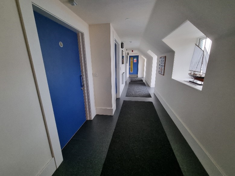 Image showing corridor leading to Accessible, Male and Female changing rooms and toilets