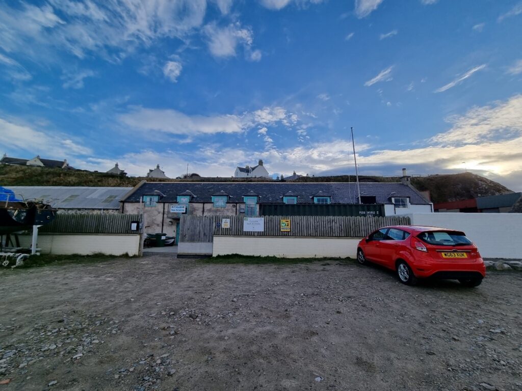 Image showing parking area in front of Cullen Sea and access gate into the sea school yard for visitors.