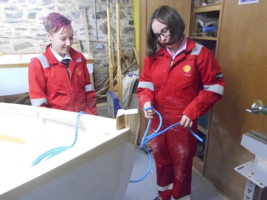 Image of two Banff Academy Students in the sea school workshop