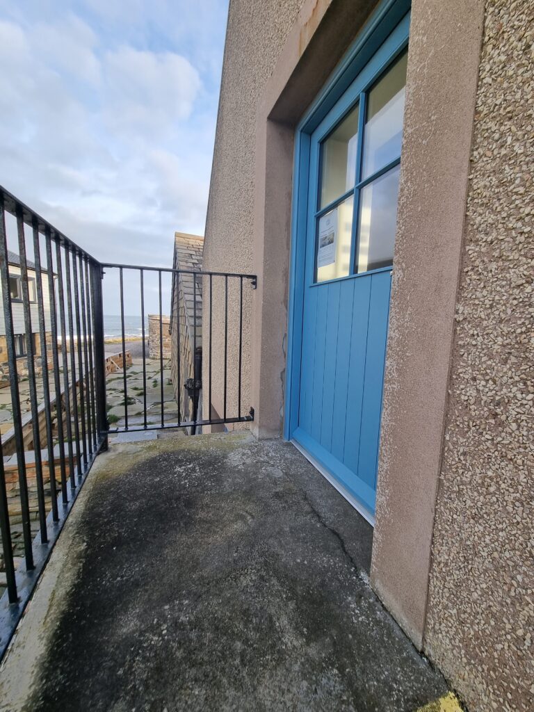 Image showing flat level platform at top of stairs leading into Harbour Building meeting room.
