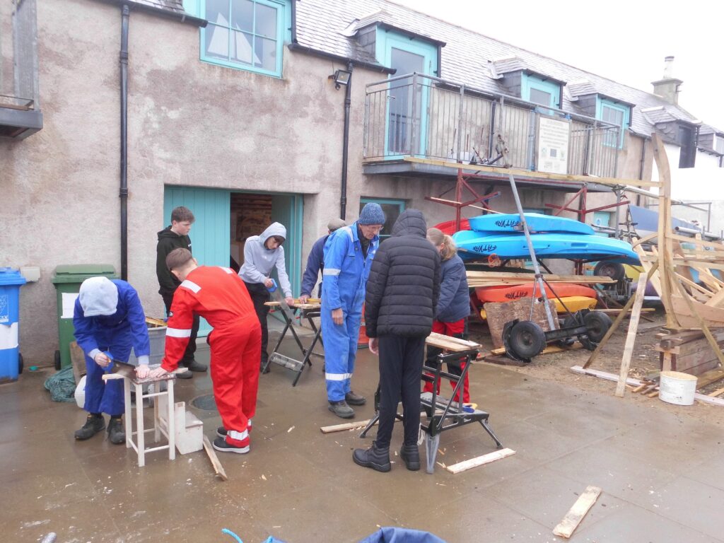 S2 Banff Academy Pupils at Cullen Sea School building a 
 Drakkar Viking Boat Replica 