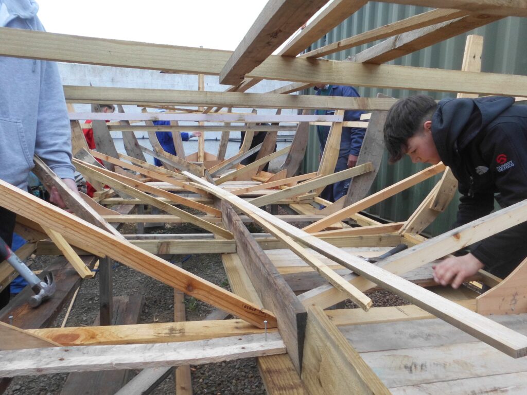 S2 Banff Academy Pupils at Cullen Sea School building a 
 Drakkar Viking Boat Replica 